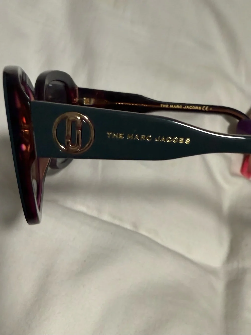Marc Jacobs Woman’s Dark Teal Square Sunglasses with alternating pink hues! New